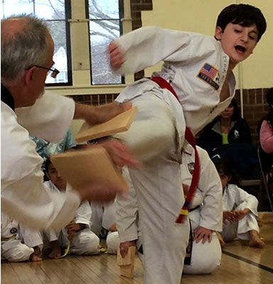 JOHN KICKING HIS WAY TO BLACK BELT